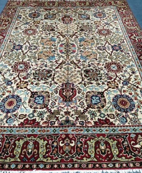 A Turkish ivory ground carpet 306 x 234cm